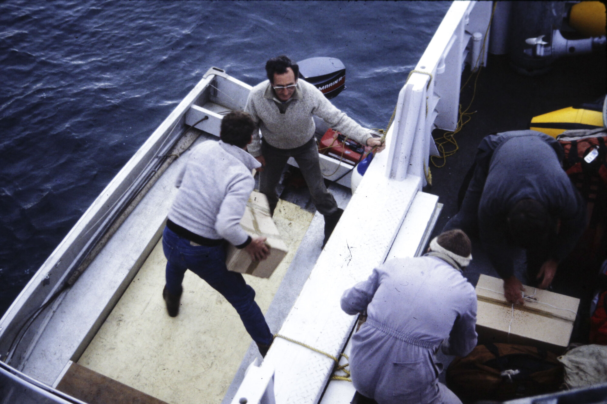 Loading the dinghy Little Barrier Island, Alex Dobbins