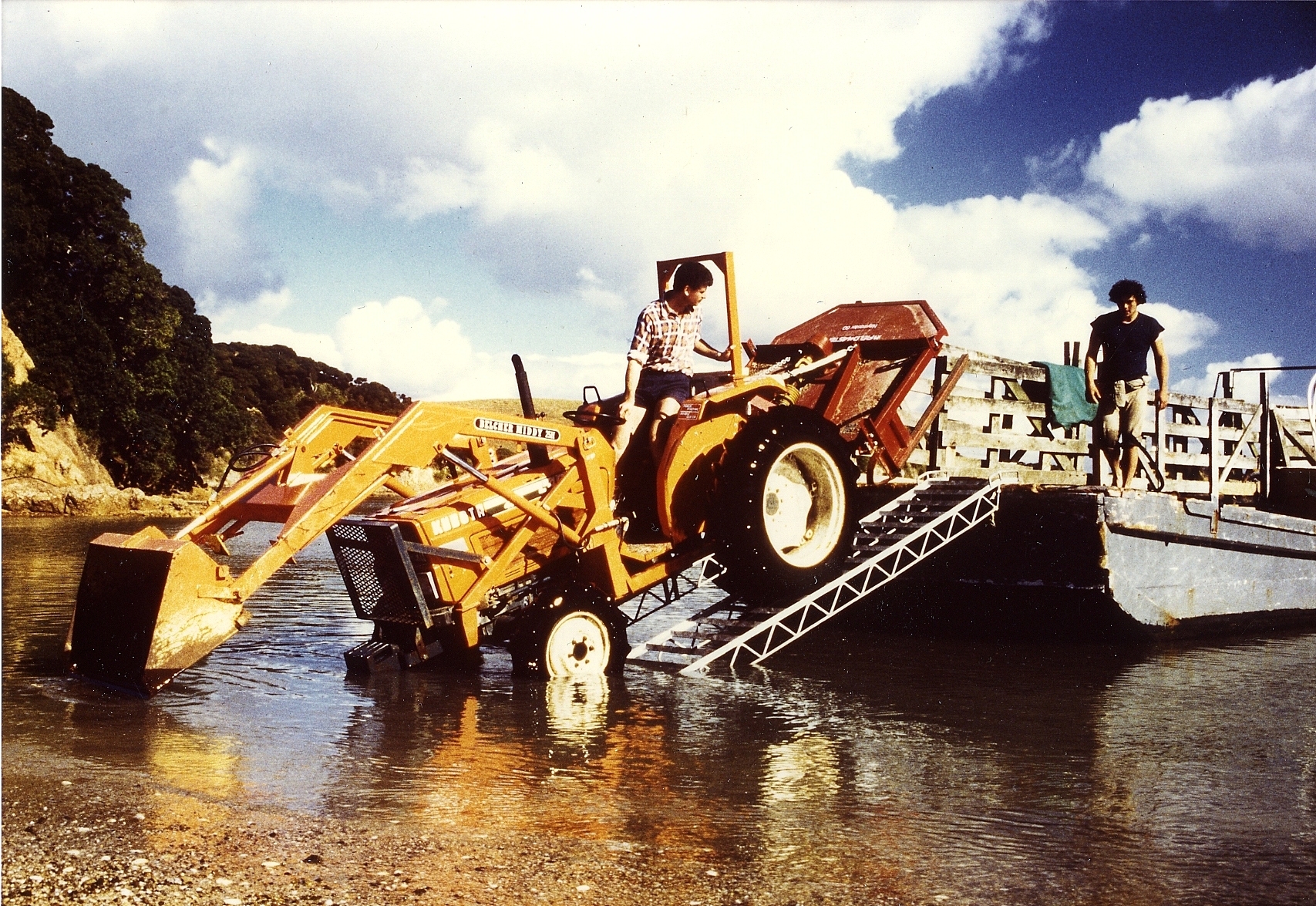 Dave Hayes loading the lawnmower (tractor) at Urupapukapuka Island 1986