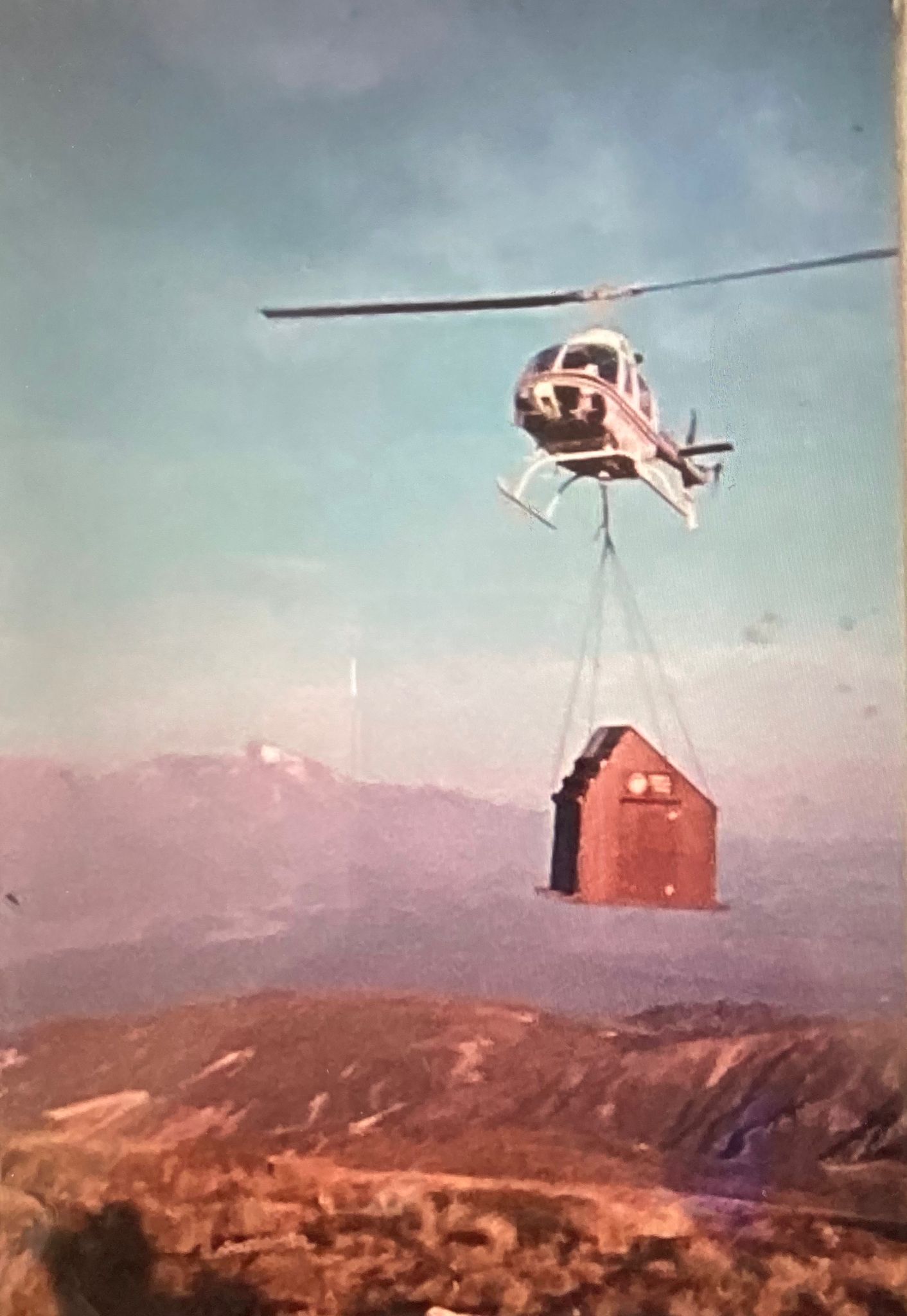 Helicoptering a toilet into a hut. Possibly Oturere hut, Tongariro National Park