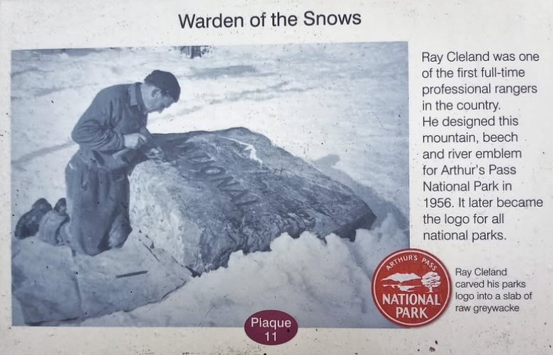 Ray Cleland carving to Arthur's Pass sign