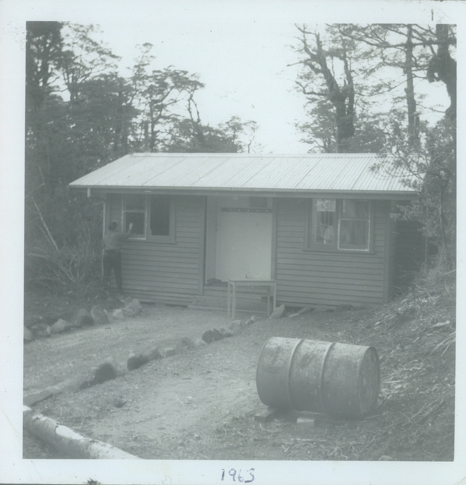 Painting a cabin: Tongariro National Park 1963