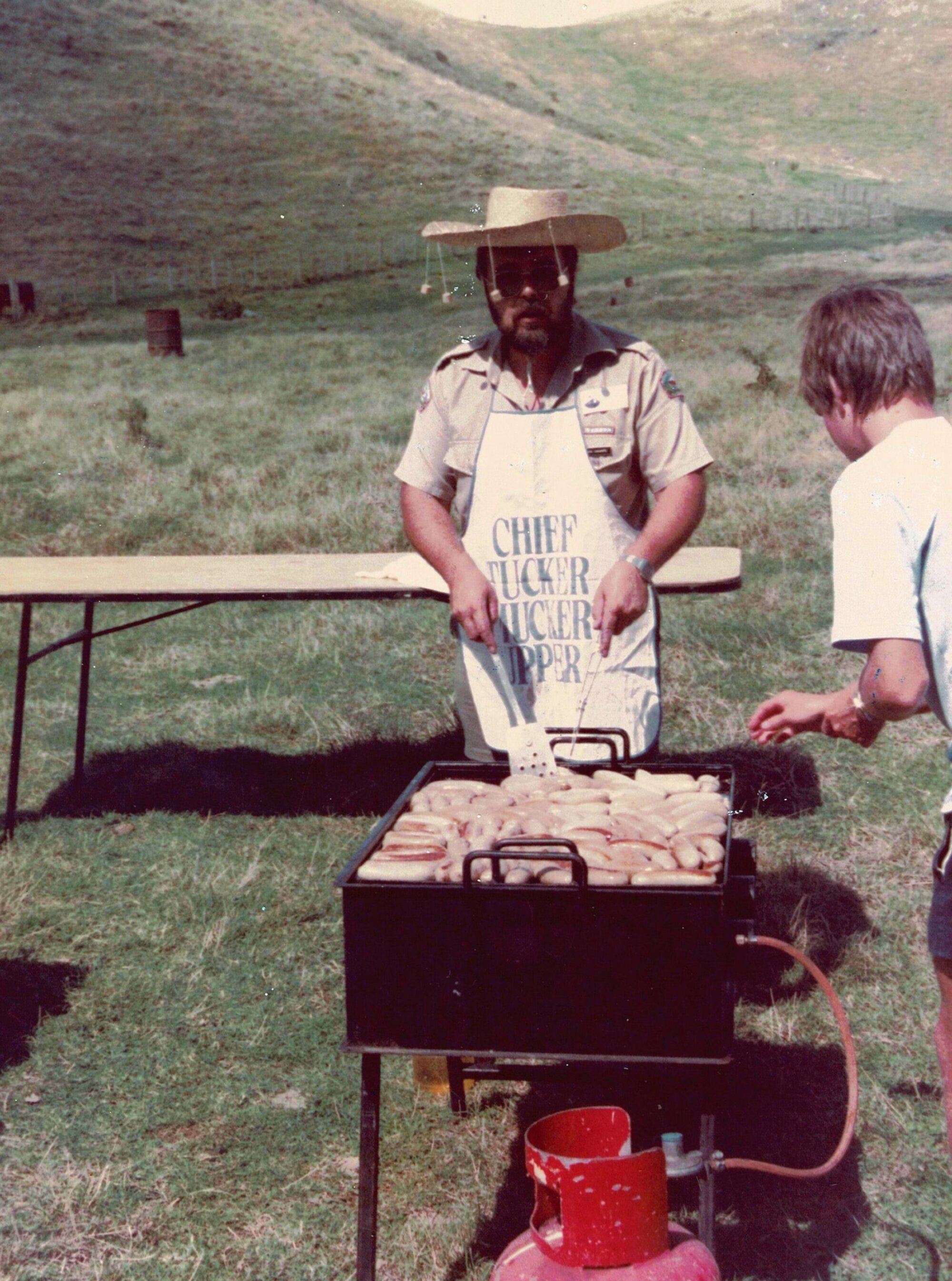 Mick Sharpe tends the BBQ at Brown's Island - Hauraki Gulf Maritime Park
