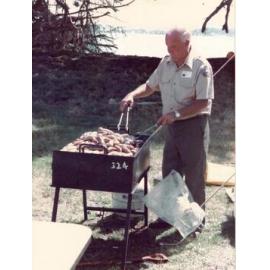 George Holmes tends the BBQ at Browns Island - Hauraki Gulf maritime Park