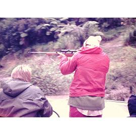 Bruce Jefferies showing relieving rangers how to shoots goats Whanganui River 1976
