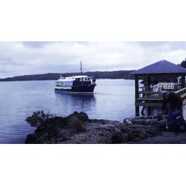 Blue Boat coming into Islington Bay Wharf, Rangitoto Island